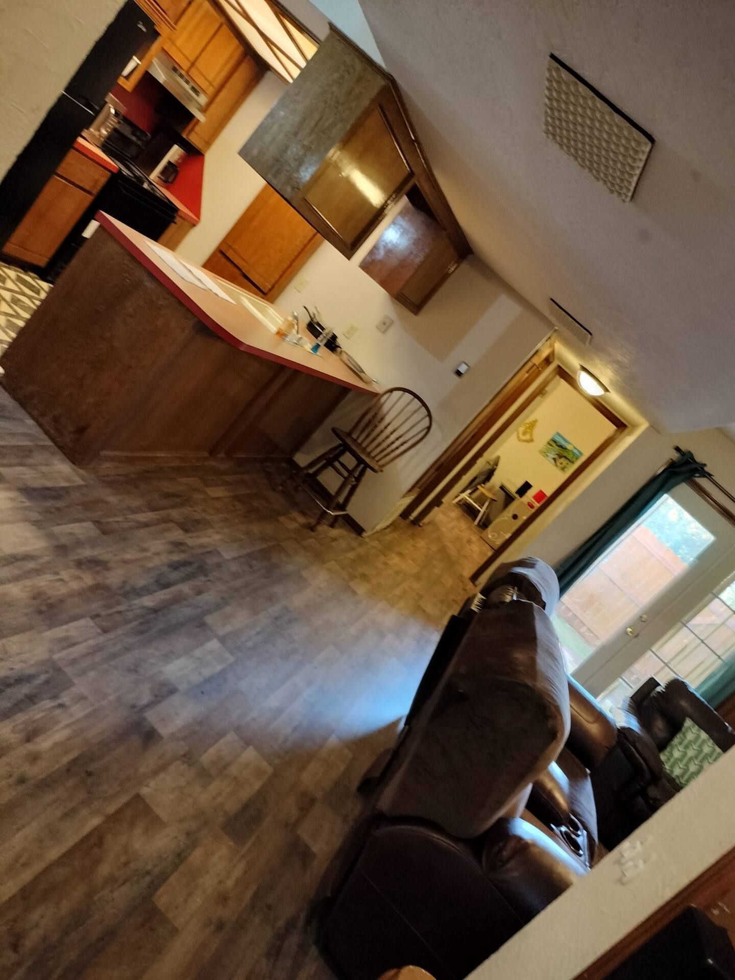 A living room filled with furniture and a kitchen