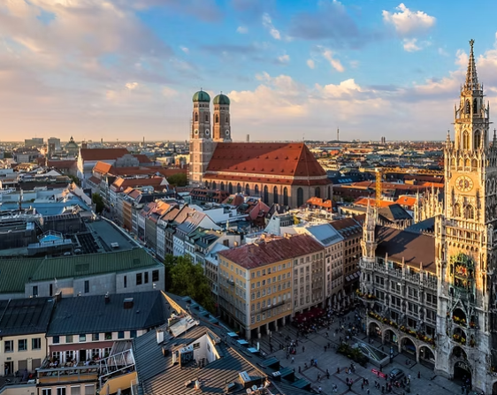 An aerial view of a city with a clock tower in the middle