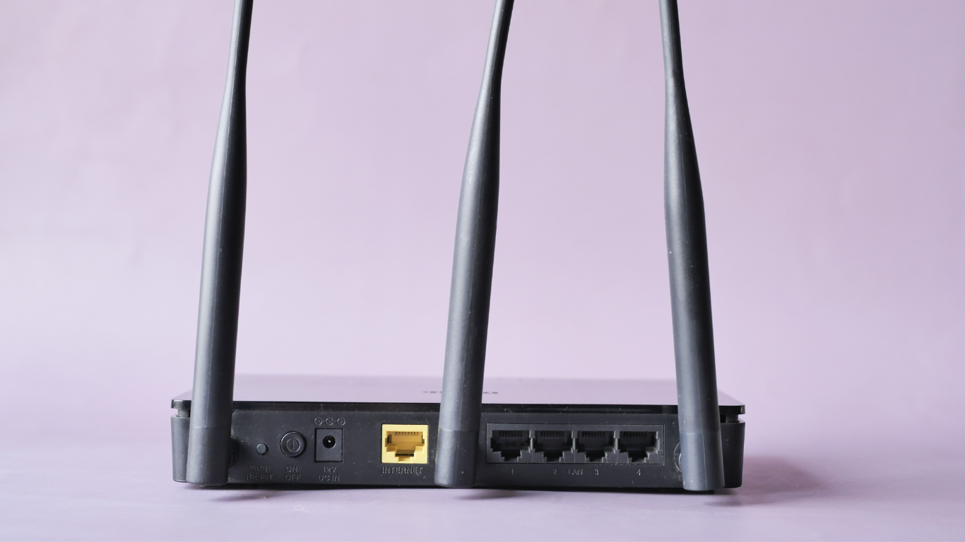 A woman is pressing a button on an intercom system.