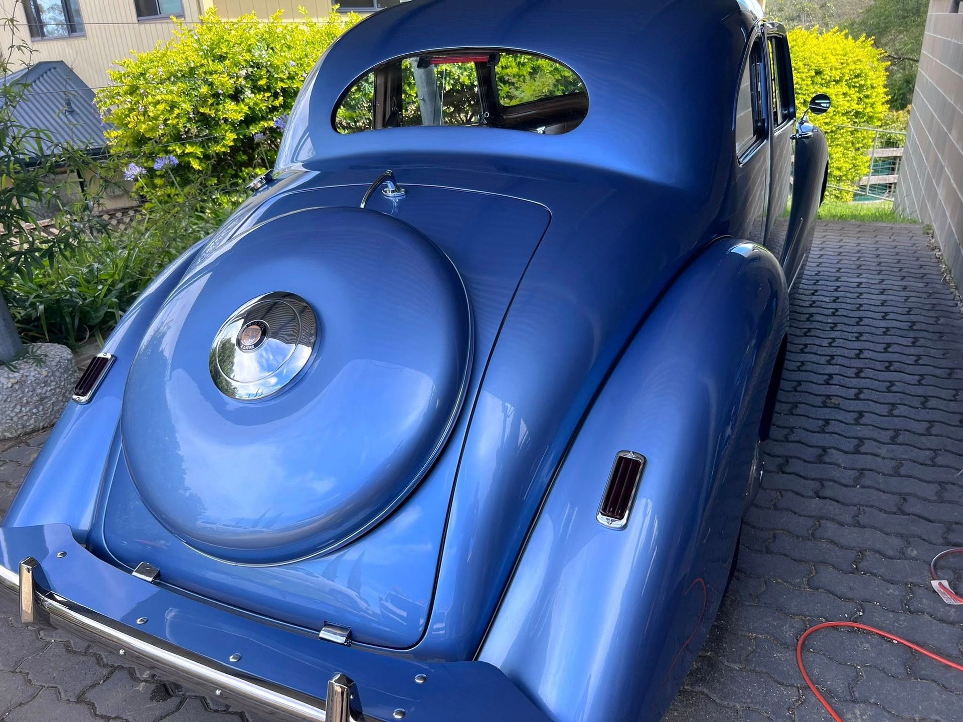 Blue Vintage Car Parked on a Driveway, Rear View With Rounded Body — Car Detailing Mobile Cleaning Co In Port Macquarie, NSW