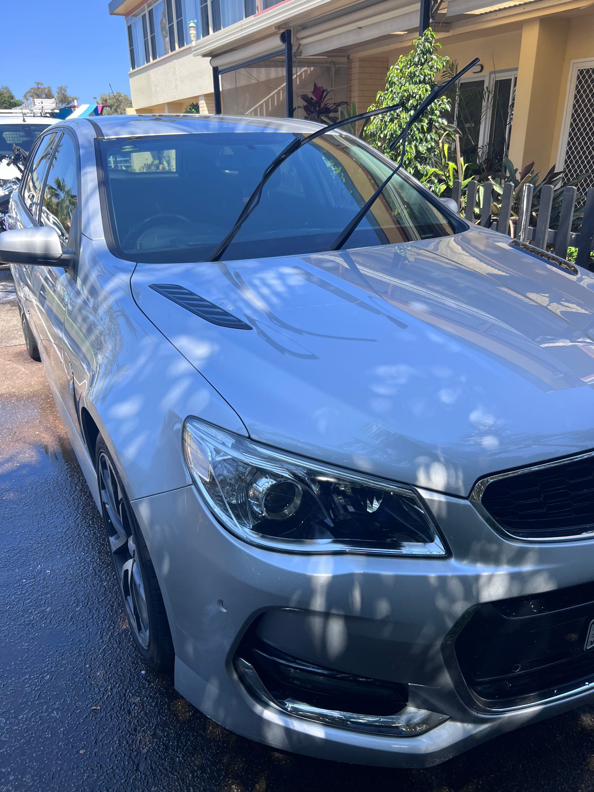 Silver Car Parked On A Sunny Residential Street Beside Houses And Greenery — Car Detailing Mobile Cleaning Co In Thrumster, NSW