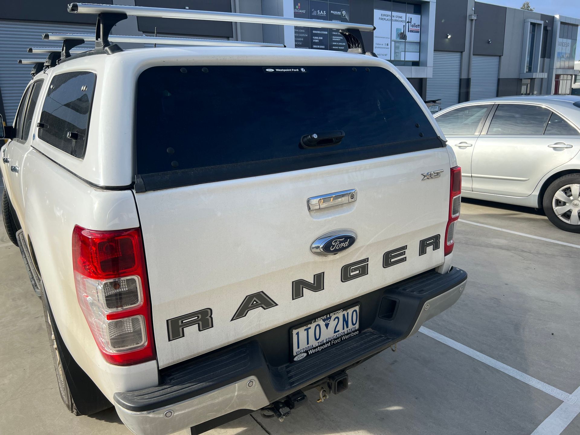 White Ford Ranger Pickup Truck Parked in a Lot — Car Detailing Mobile Cleaning Co In Wauchope, NSW