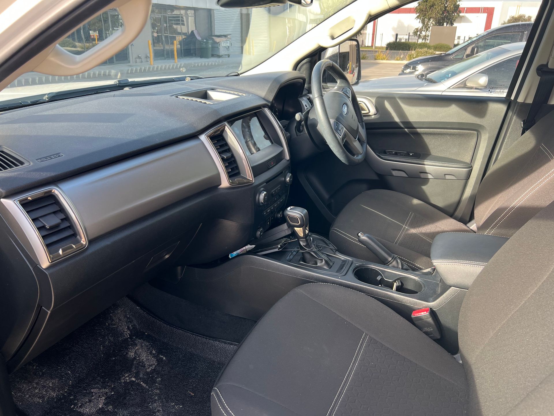 Car Interior With Black Dashboard, Steering Wheel — Car Detailing Mobile Cleaning Co In Thrumster, NSW