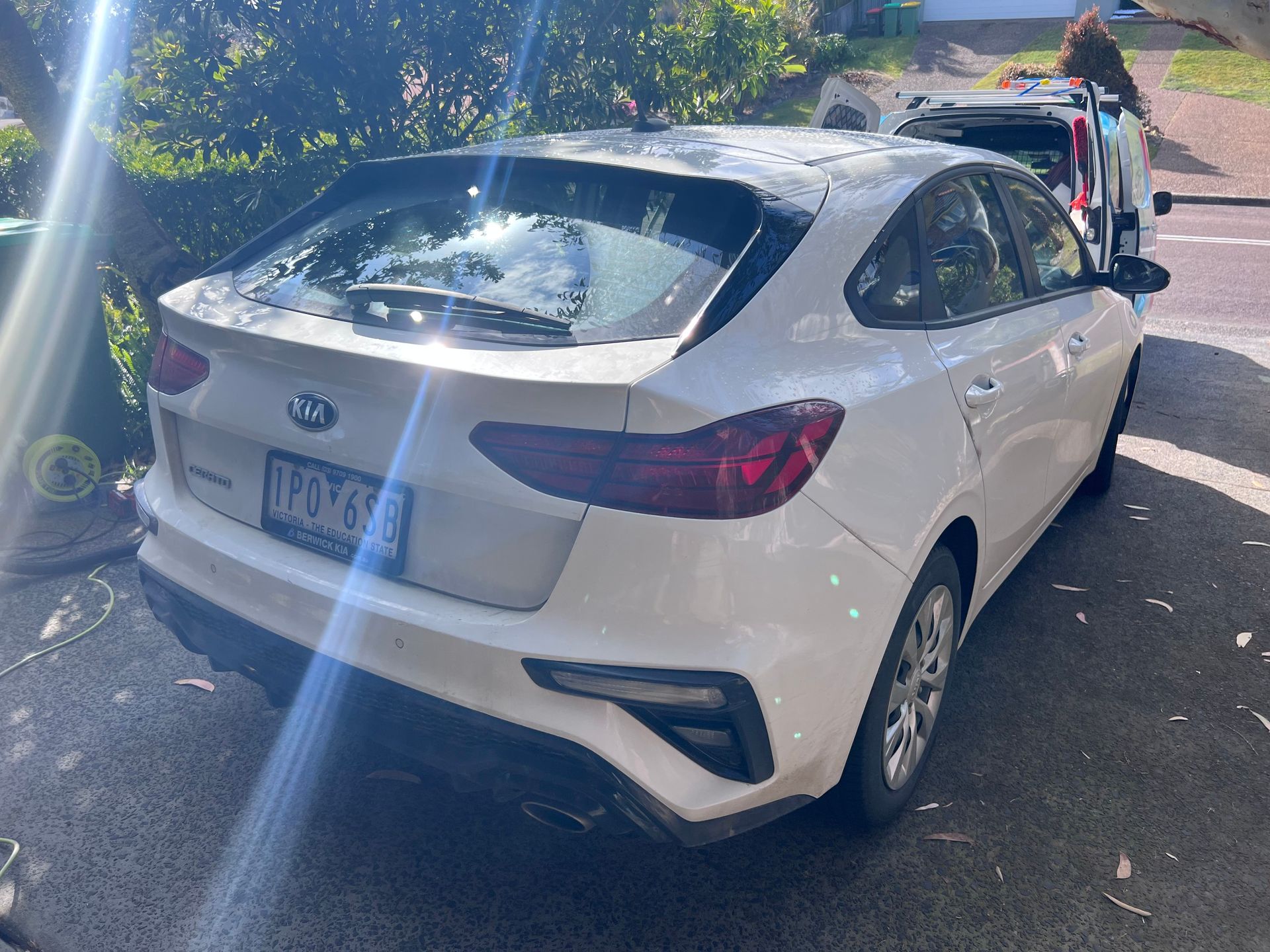 White Hatchback Parked on a Sunlit Street — Car Detailing Mobile Cleaning Co In Port Macquarie, NSW