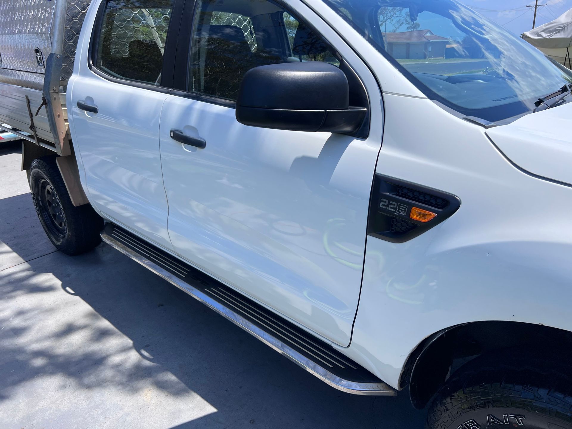White Pickup Truck Parked Outdoors in Sunlight, Side View With Black Trim — Car Detailing Mobile Cleaning Co In Wauchope, NSW