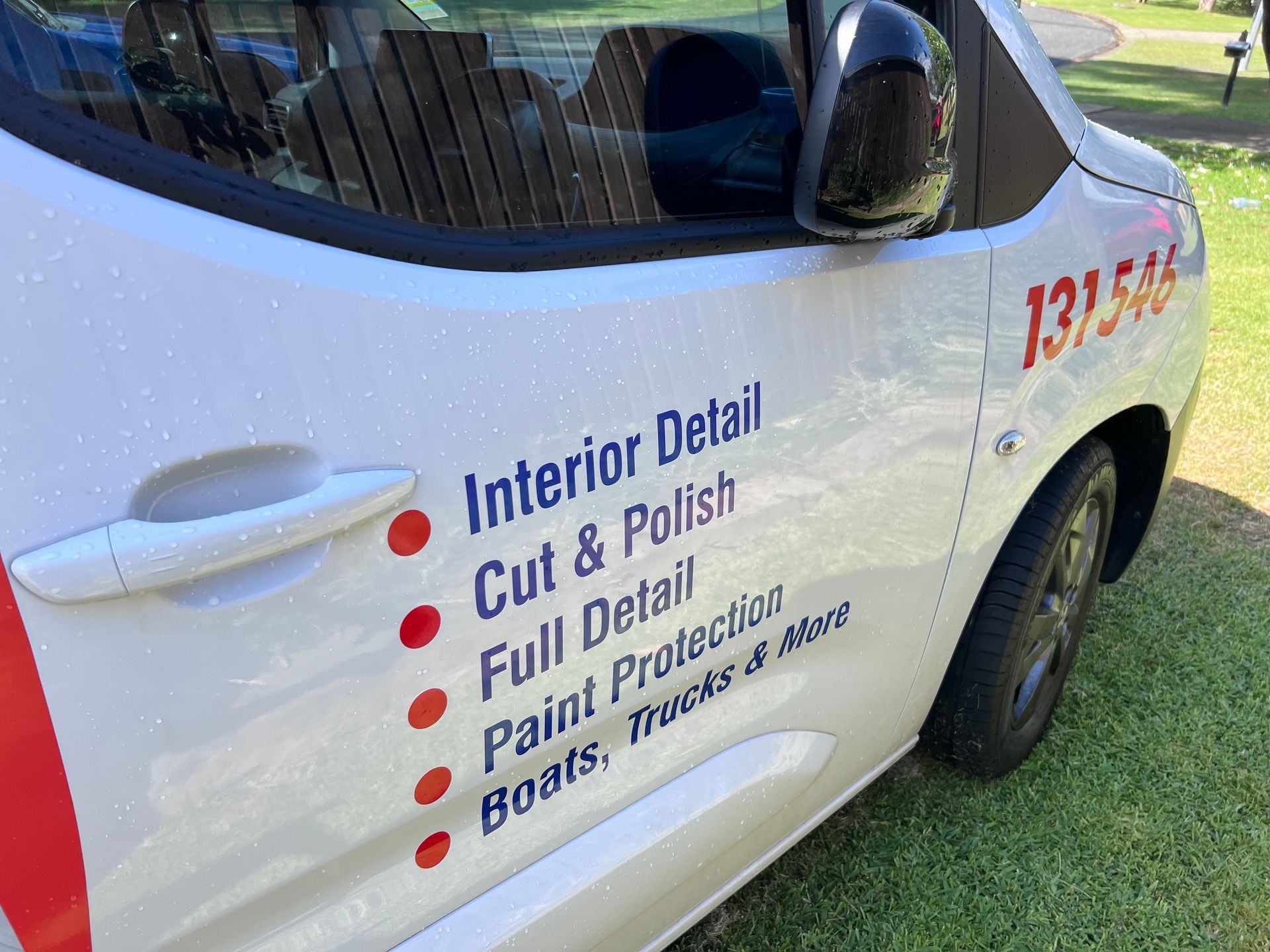 White service van with โInterior Detailโ and other cleaning service text on the side โ Car Detailing Mobile Cleaning Co In Port Macquarie, NSW