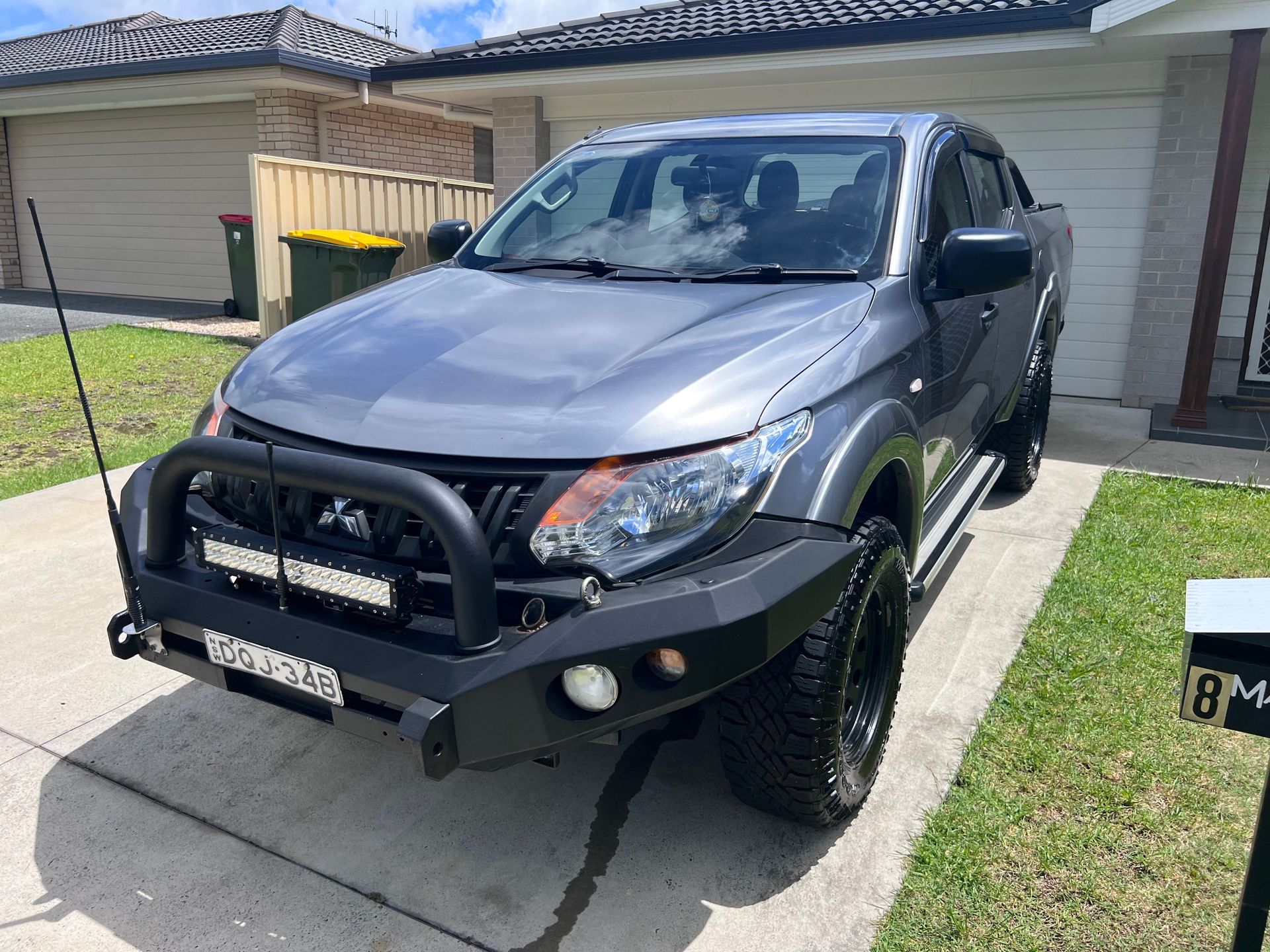 Grey Pickup Truck Parked in a Driveway — Car Detailing Mobile Cleaning Co In Lake Cathie, NSW