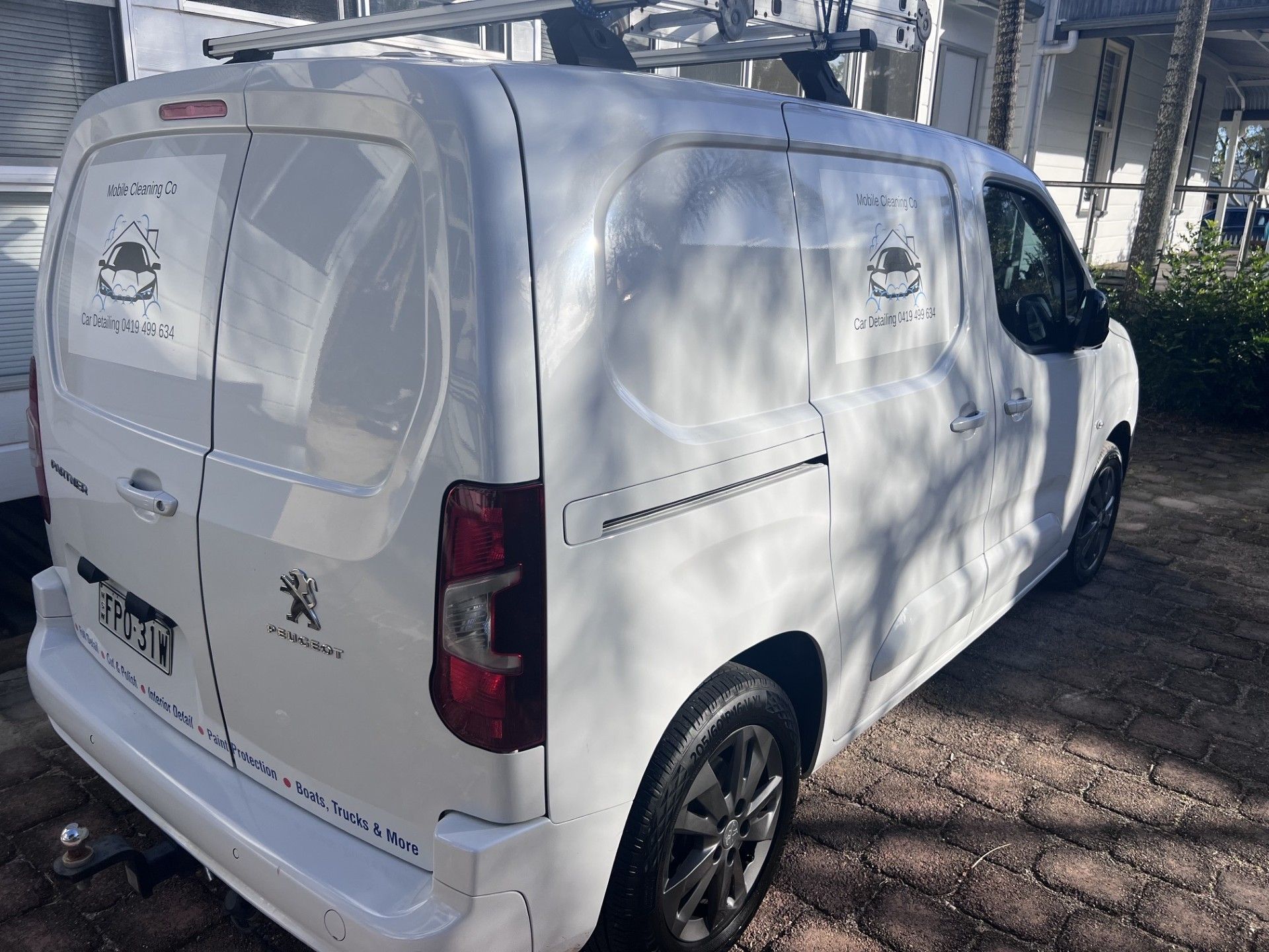 White Cargo Van Parked Outdoors Under Tree Shadows, Side And Rear View โ Car Detailing Mobile Cleaning Co In Port Macquarie, NSW