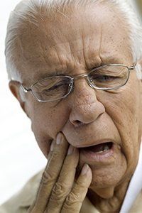 Elderly Man Suffering from Toothache — Orange, CT — New England Dental Health Services PC