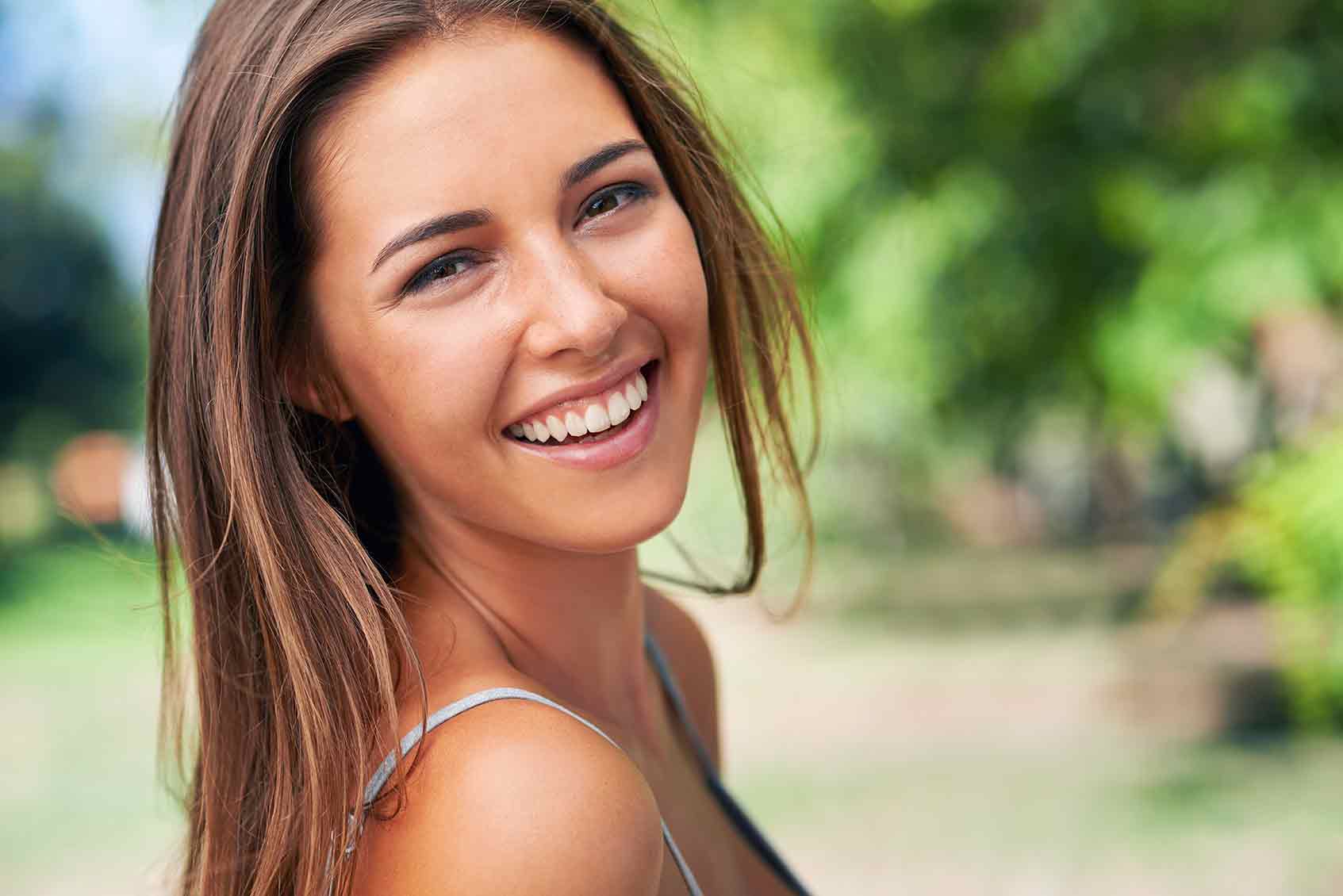 Smiling Beautiful Woman — Orange, CT — New England Dental Health Services PC