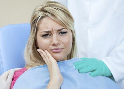 Woman Suffering from Toothache — Orange, CT — New England Dental Health Services PC