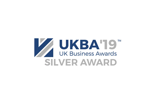 The uk business awards silver award logo is on a white background.