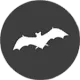 White bat silhouette on a dark gray circle.