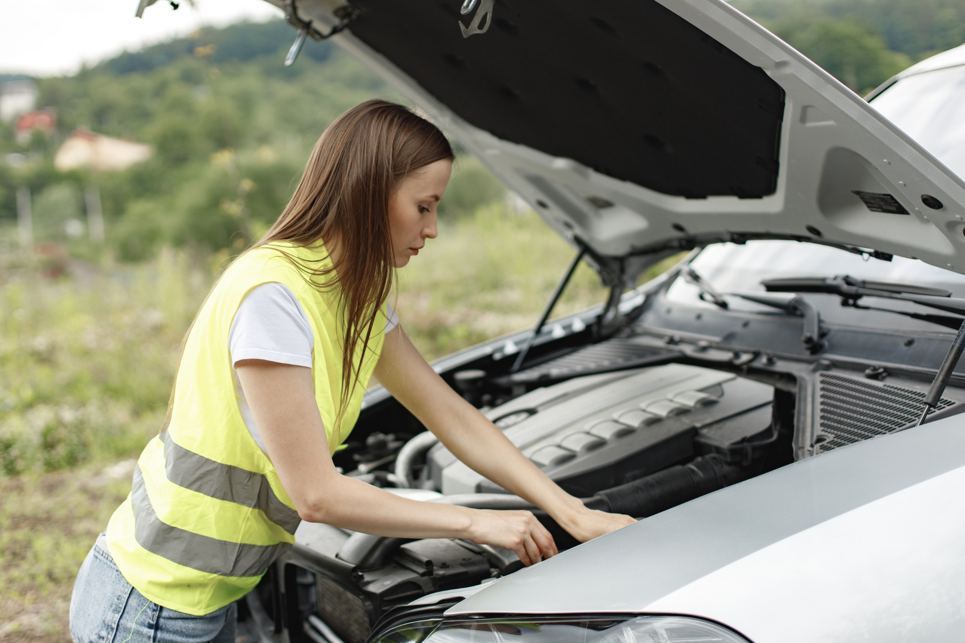 Woman Fixing Car Engine