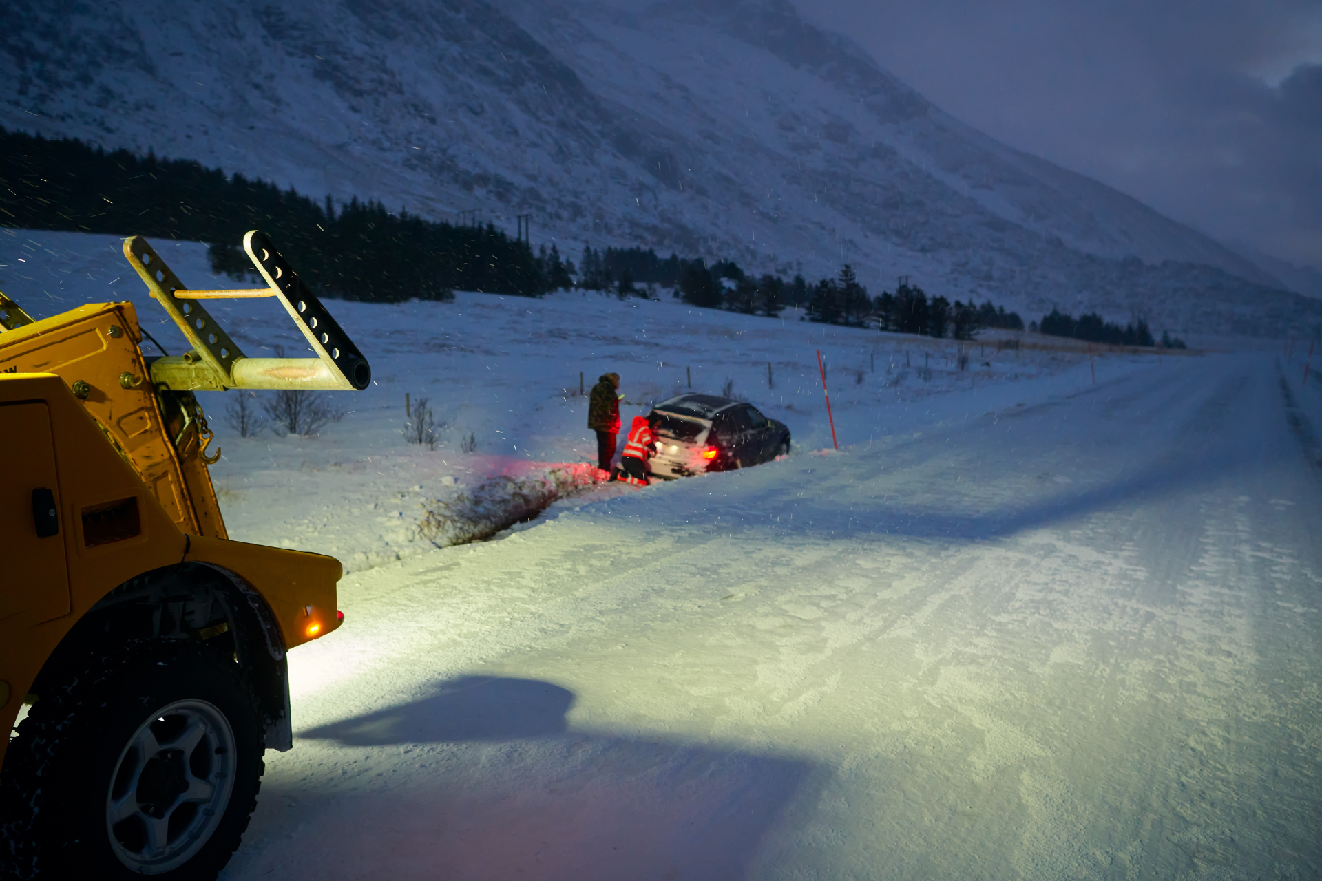 Car Being Towed after Accident in Snow Storm