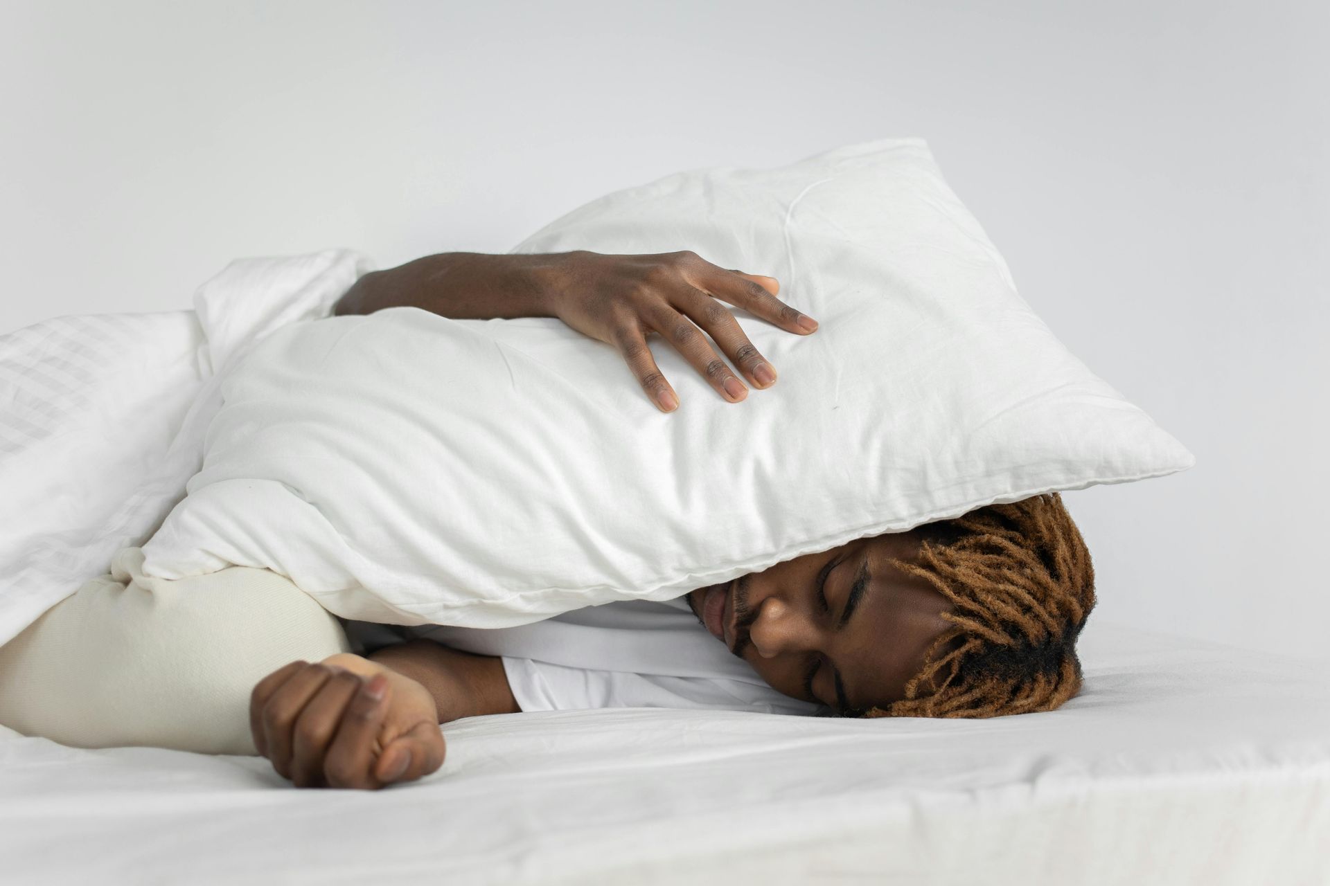 A person sleeping peacefully, symbolizing the connection between sleep and managing RA symptoms.