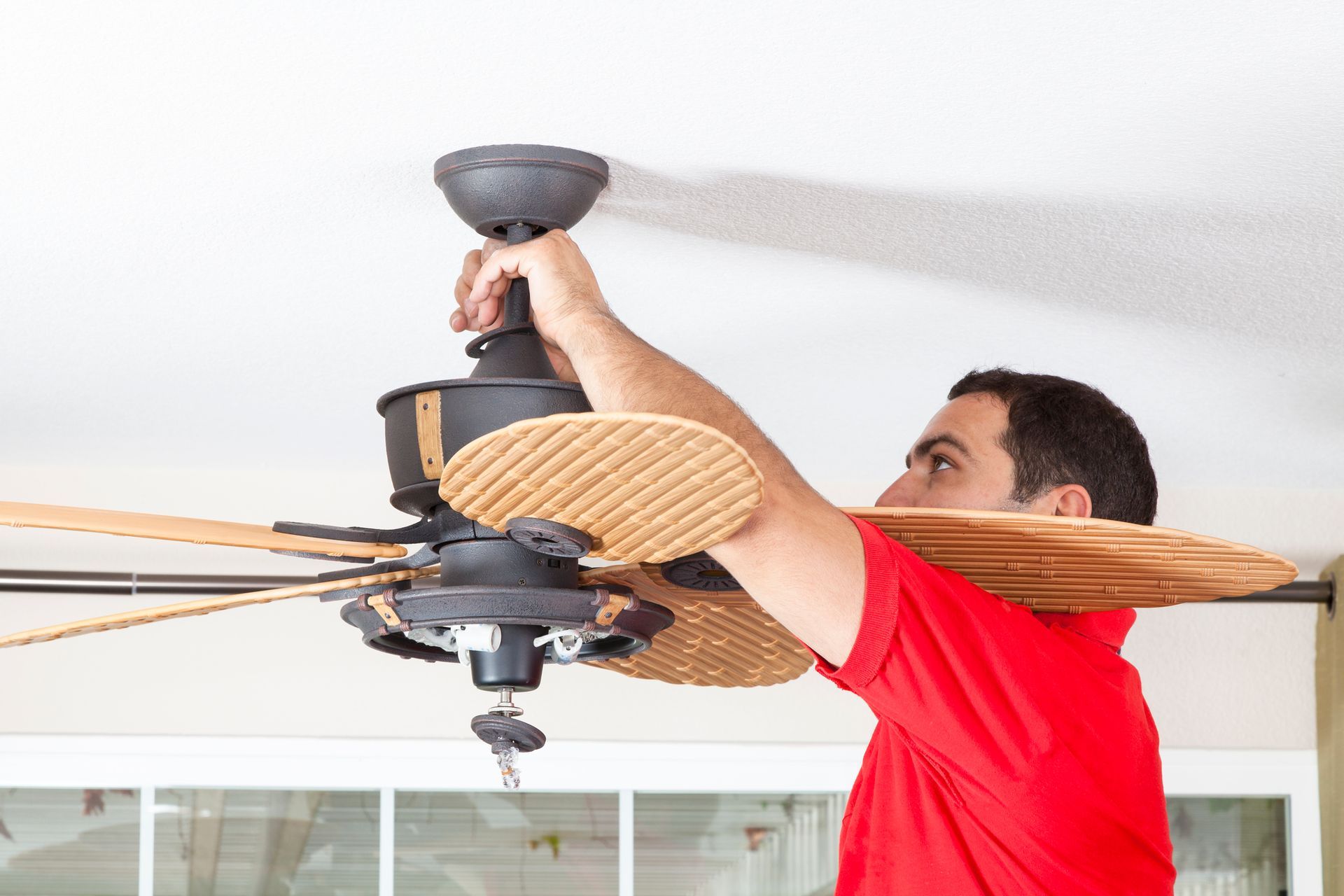 Modern ceiling fan installation by Hogue Electric.