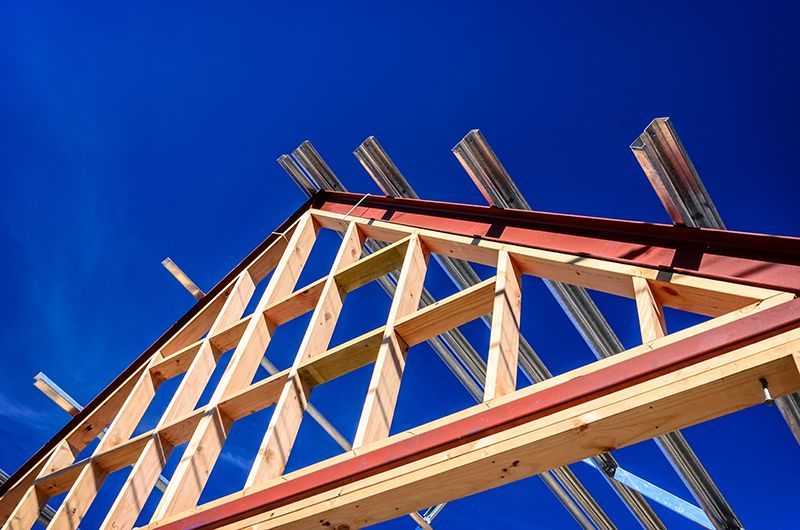 a building under construction with a blue sky in the background