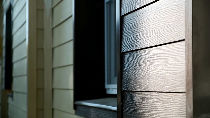 a close up of a house with a window and siding .