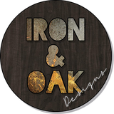 a sign that says iron and oak designs on it