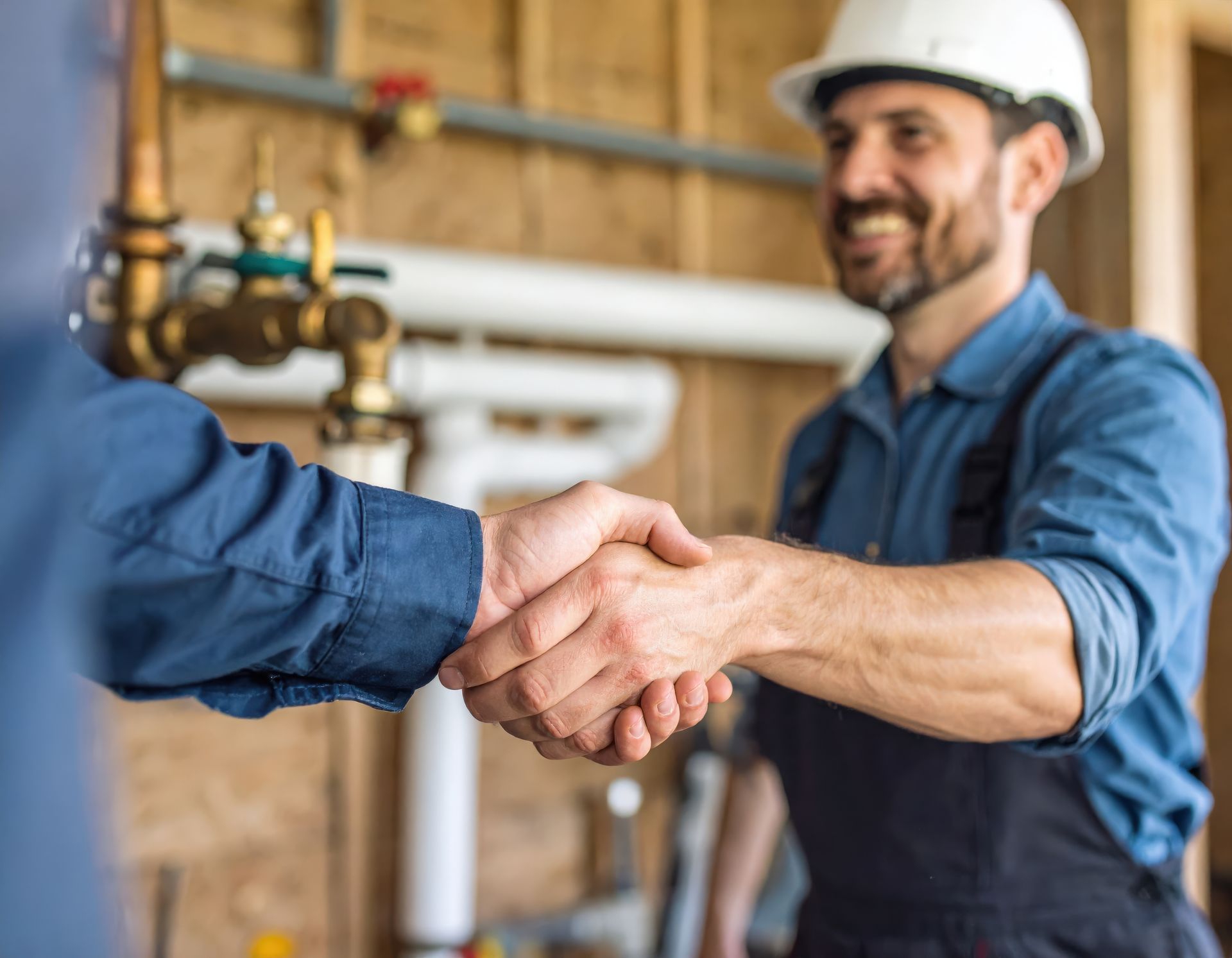Atlantic Green plumbing contractor shaking hands with a Fredericksburg homeowner after completing a residential plumbing repair. Atlantic Green plumbing contractor shaking hands with a Fredericksburg homeowner after completing a residential plumbing repair.