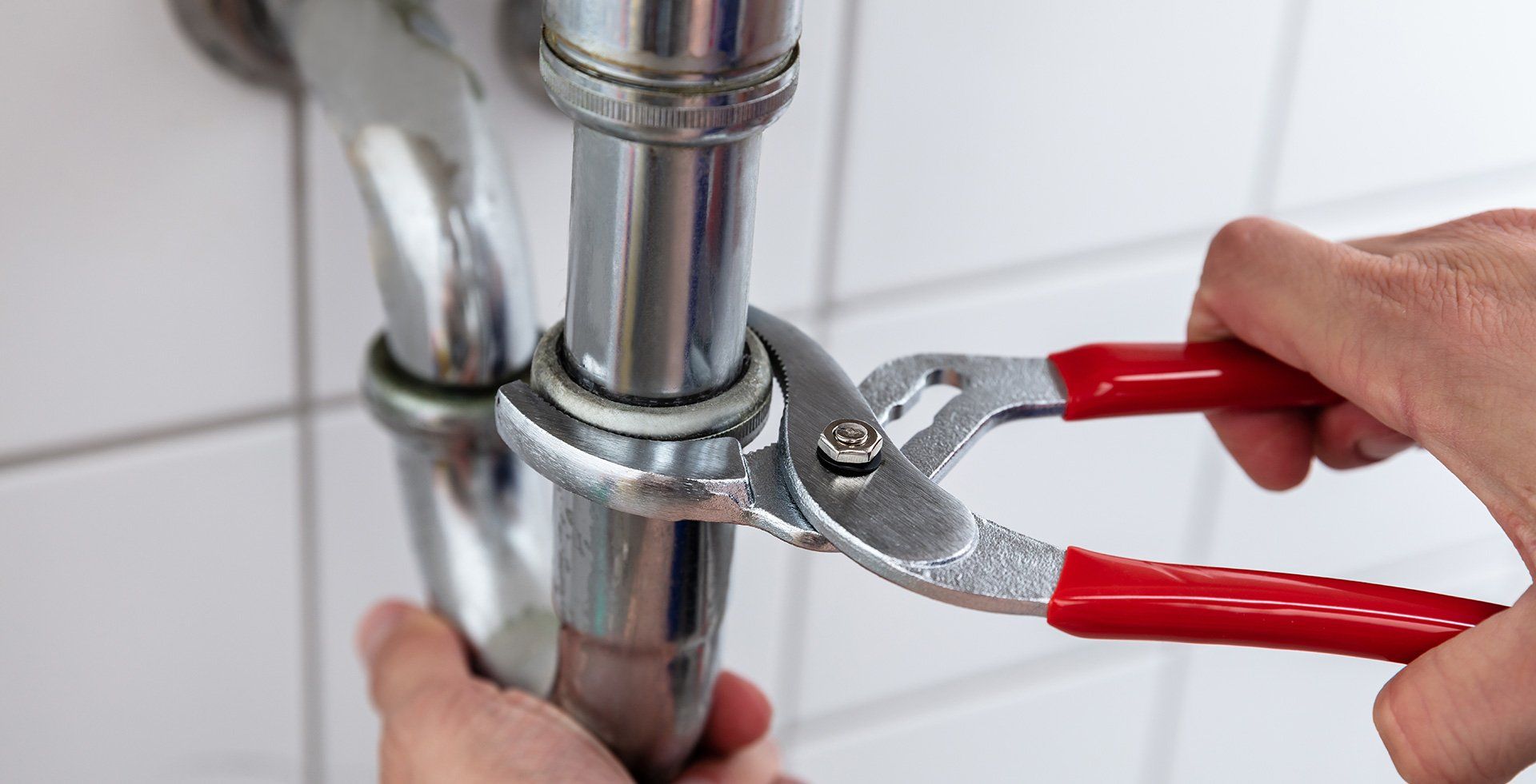 Residential Plumber — Plumber Fixing Sink Pipe in Fredericksburg, VA