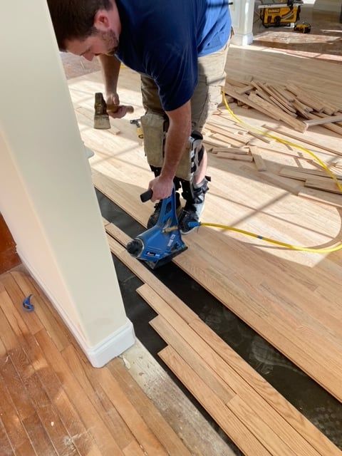 laying down flooring
