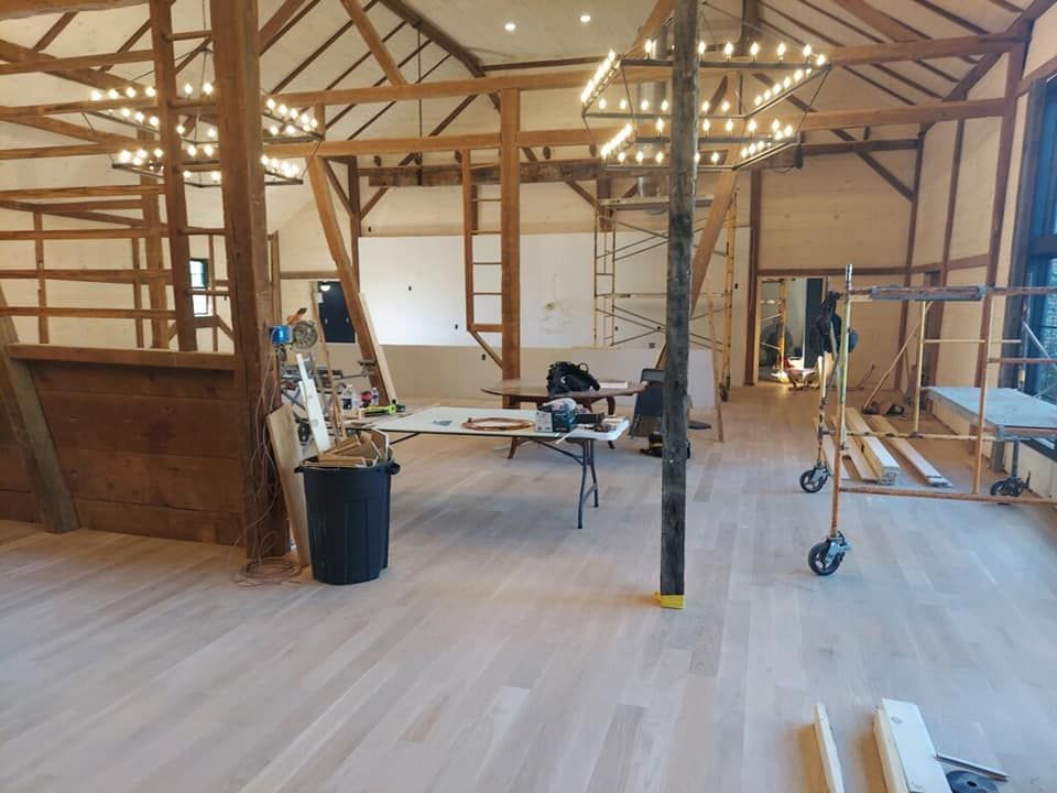 A large room with wooden beams and scaffolding in it