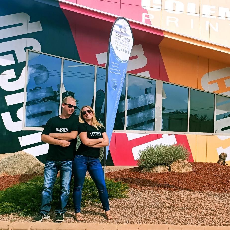 a Man and a Woman Standing in Front of a Building — Pinpoint In Darwin, NT