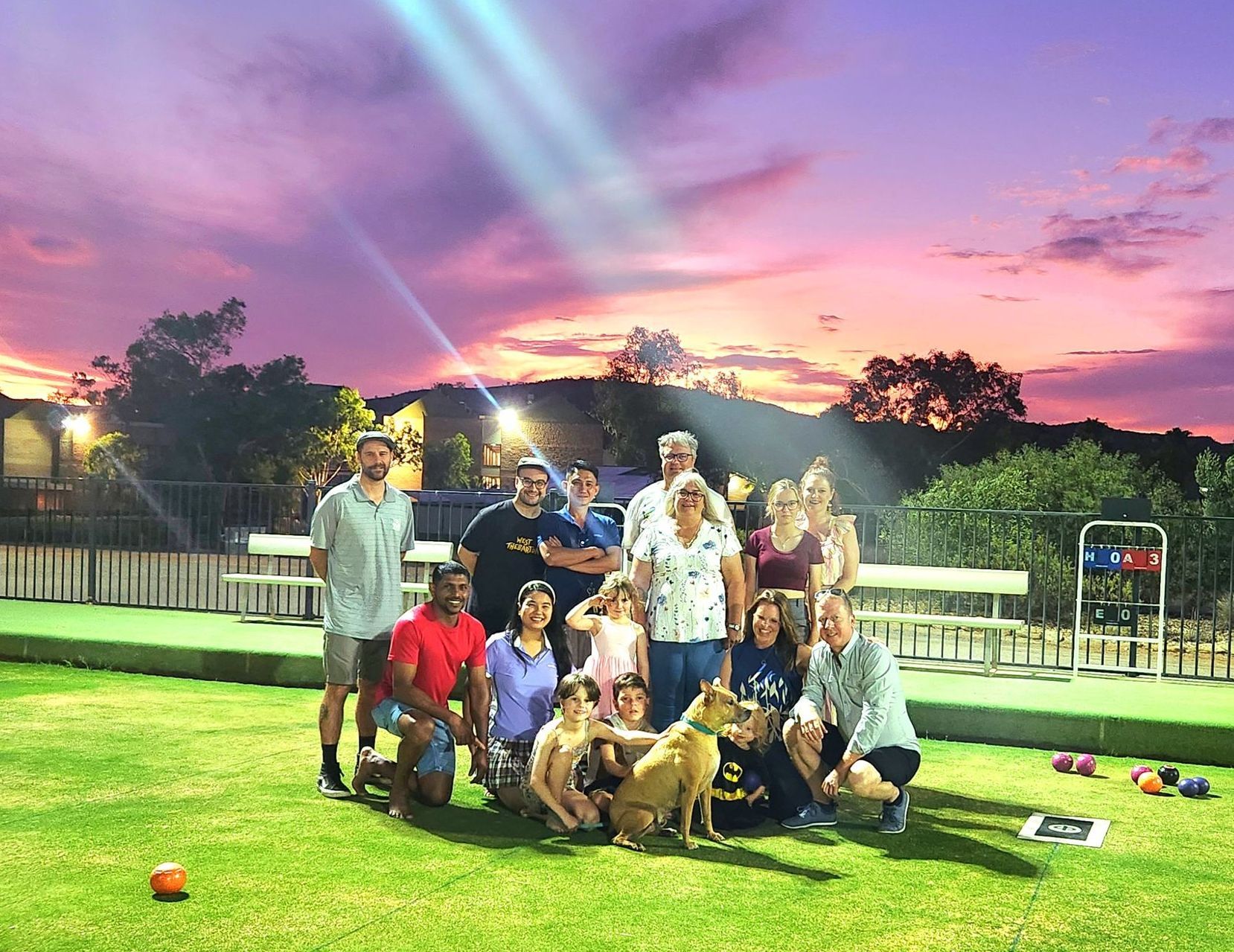 a Group of People Standing Around a Counter With a Dog — Pinpoint In Alice Springs, NT