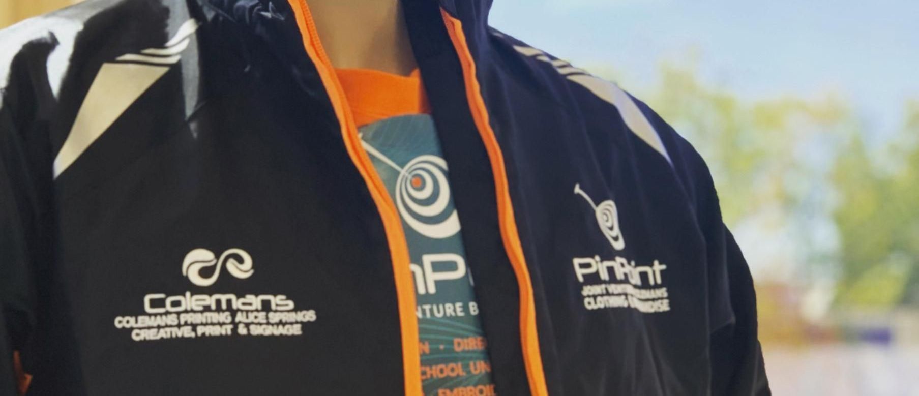 a Person Wearing a Coleman Jacket and an Orange Shirt — Pinpoint In Alice Springs, NT
