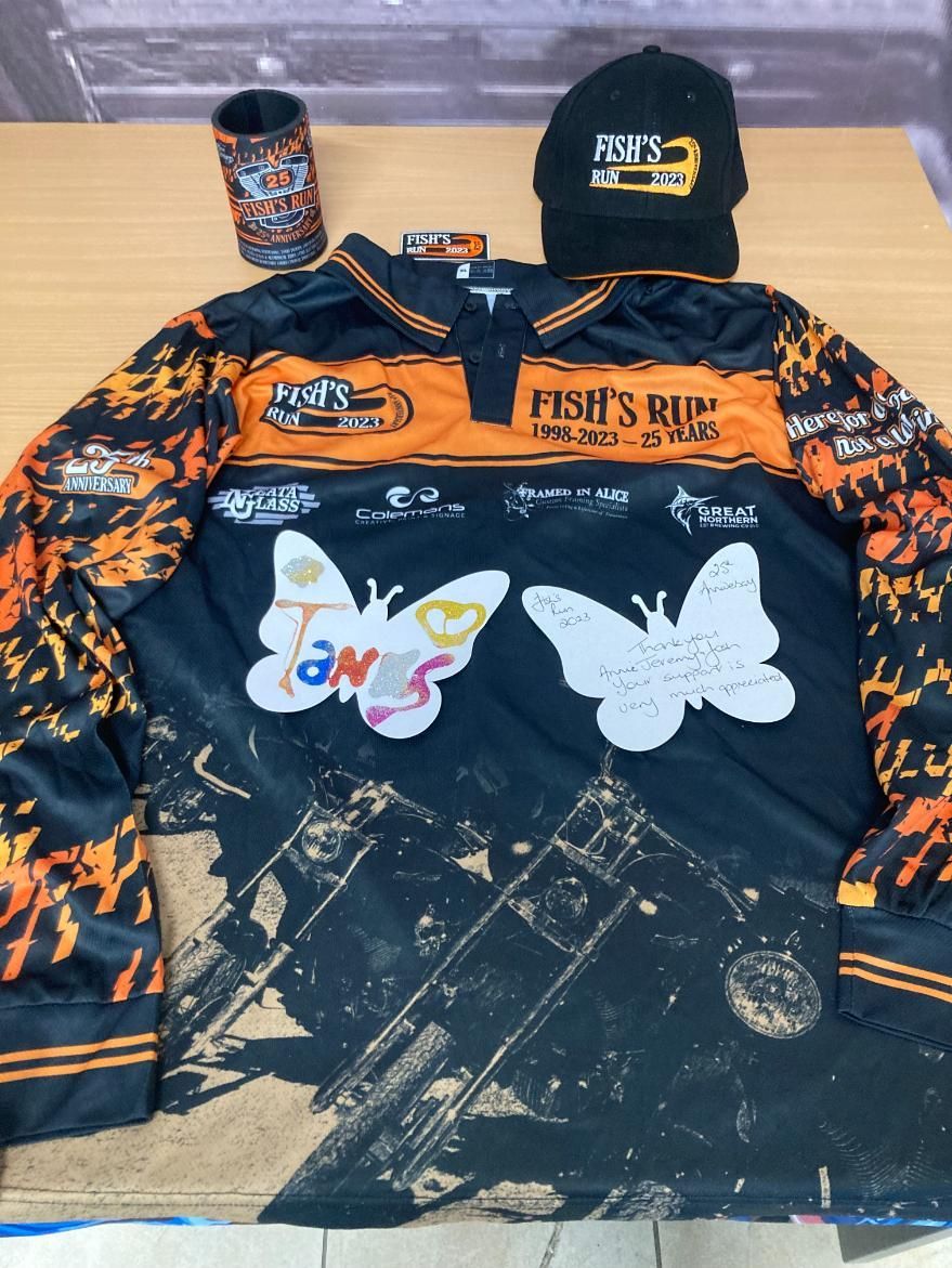 a Black and Orange Shirt With Two Butterflies on It — Pinpoint In Alice Springs, NT