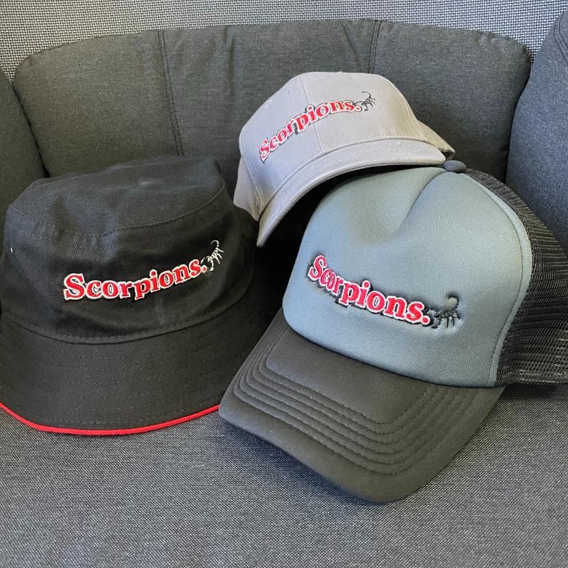 Three Hats With the Word Scorpions on Them — Pinpoint In Alice Springs, NT