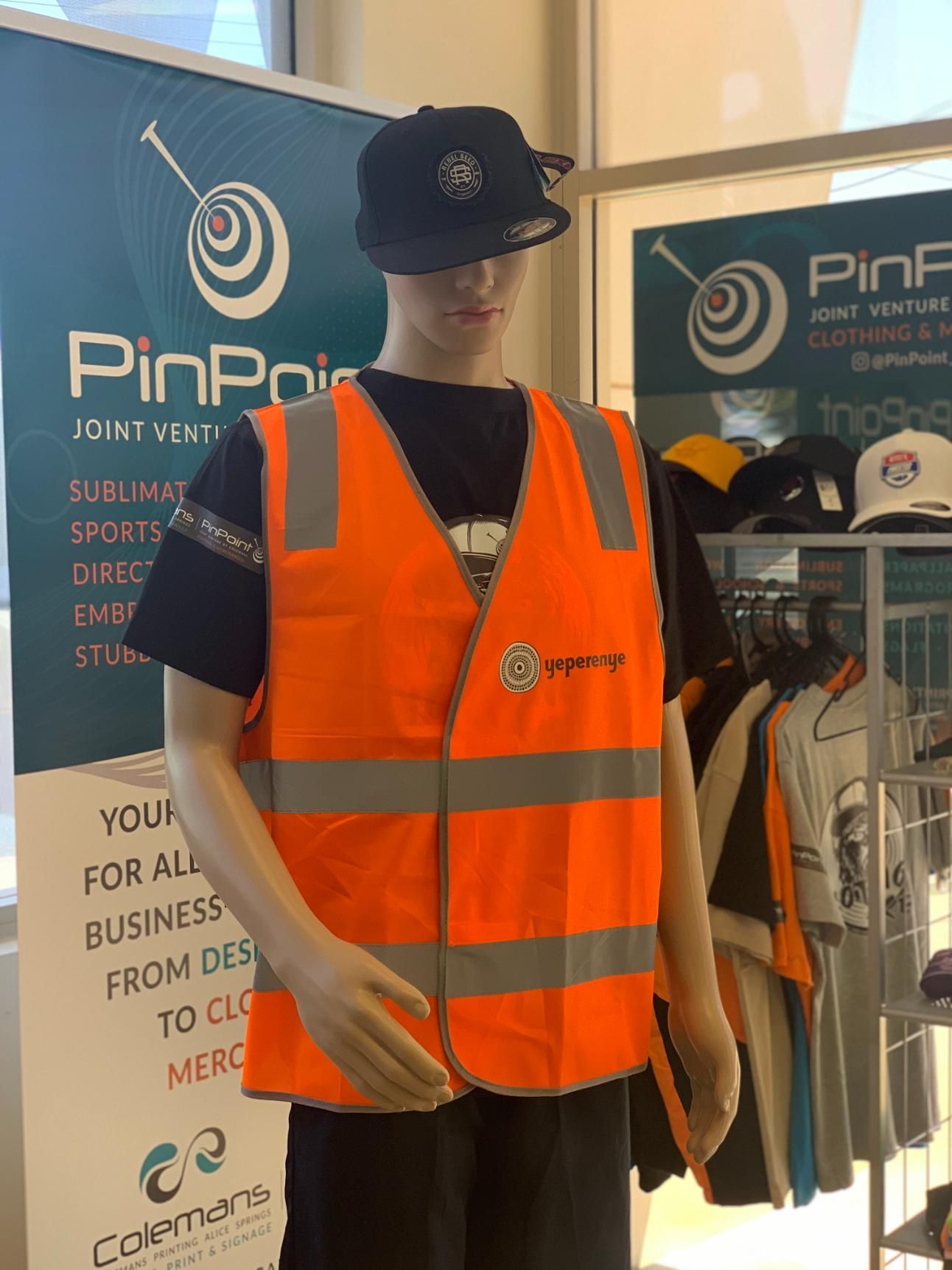 a Mannequin Wearing an Orange Safety Vest and a Black Hat — Pinpoint In Alice Springs, NT