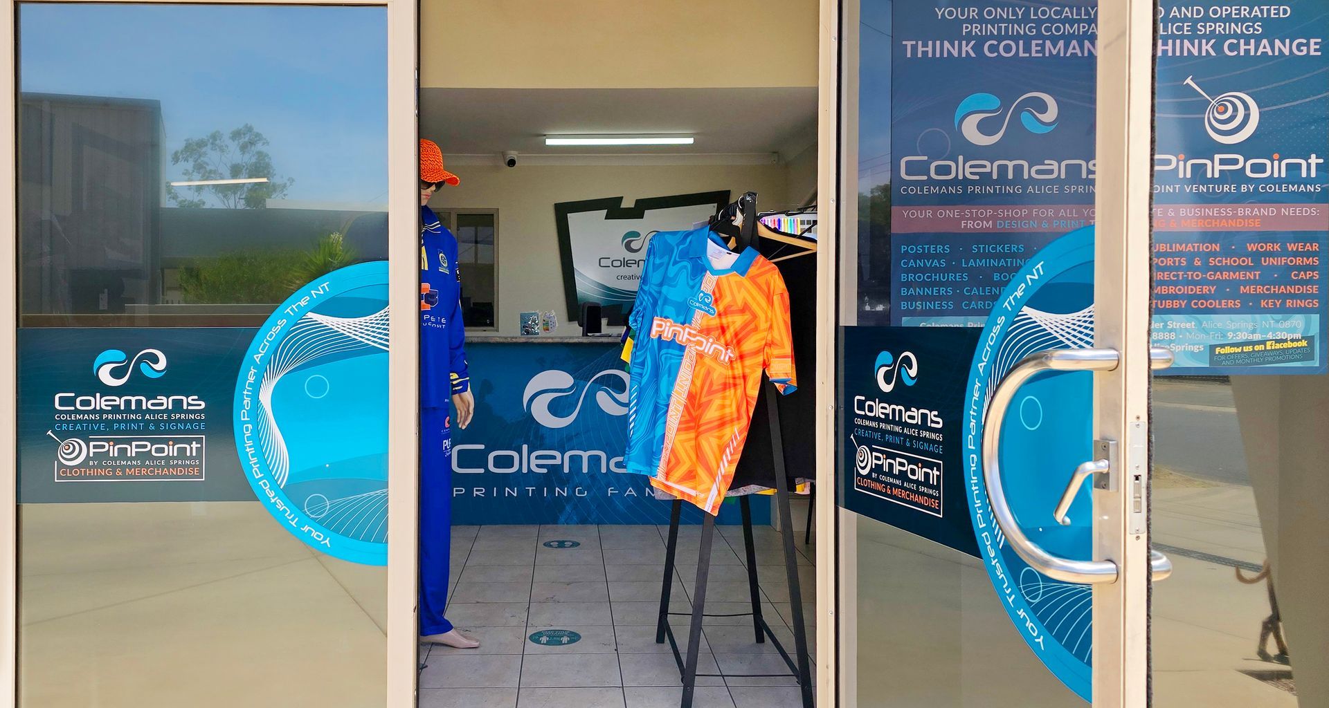 a Gray T-shirt With a Picture of a Man on It is Hanging on a Rack — Pinpoint In Alice Springs, NT