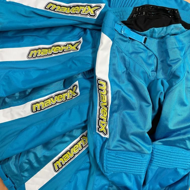 a Pair of Blue Maverix Pants Are Stacked on Top of Each Other — Pinpoint In Alice Springs, NT