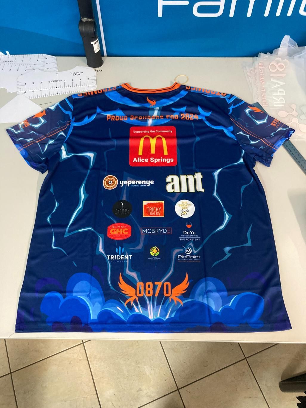 a Blue Shirt With a Mcdonald's Logo on It — Pinpoint In Alice Springs, NT