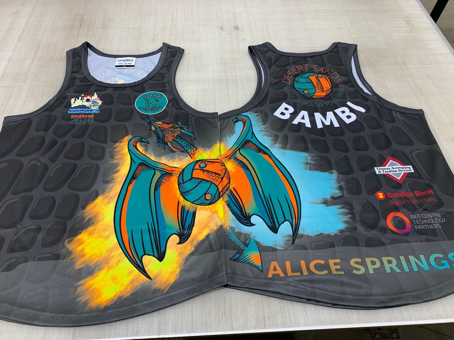 a Black and Orange Polo Shirt That Says Asco on It — Pinpoint In Alice Springs, NT