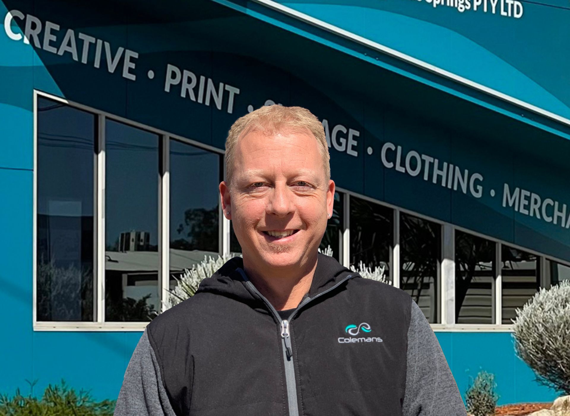 a Group of People Standing Around a Counter With a Dog — Pinpoint In Alice Springs, NT
