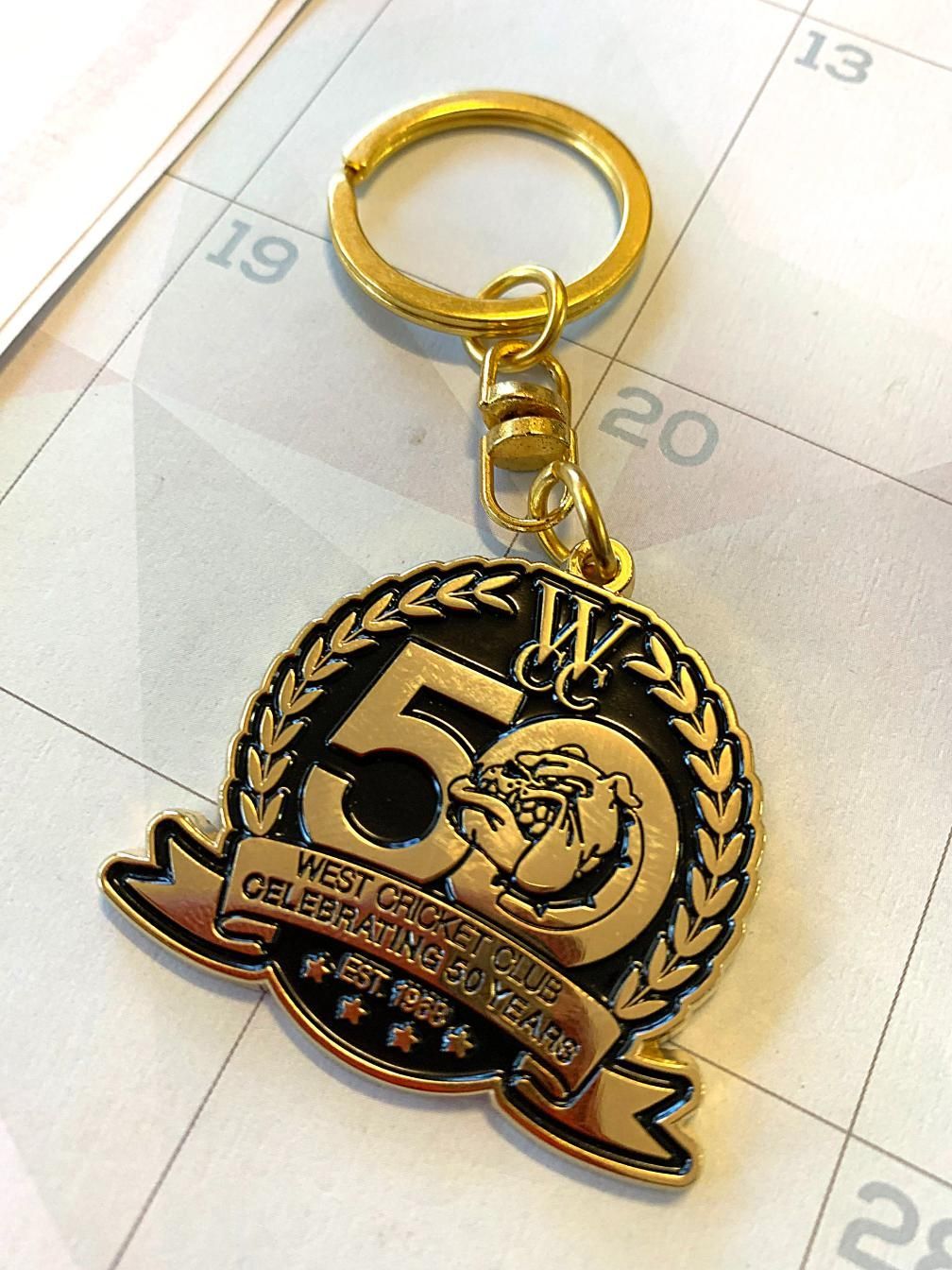 a Keychain With the Number 50 on It — Pinpoint In Alice Springs, NT