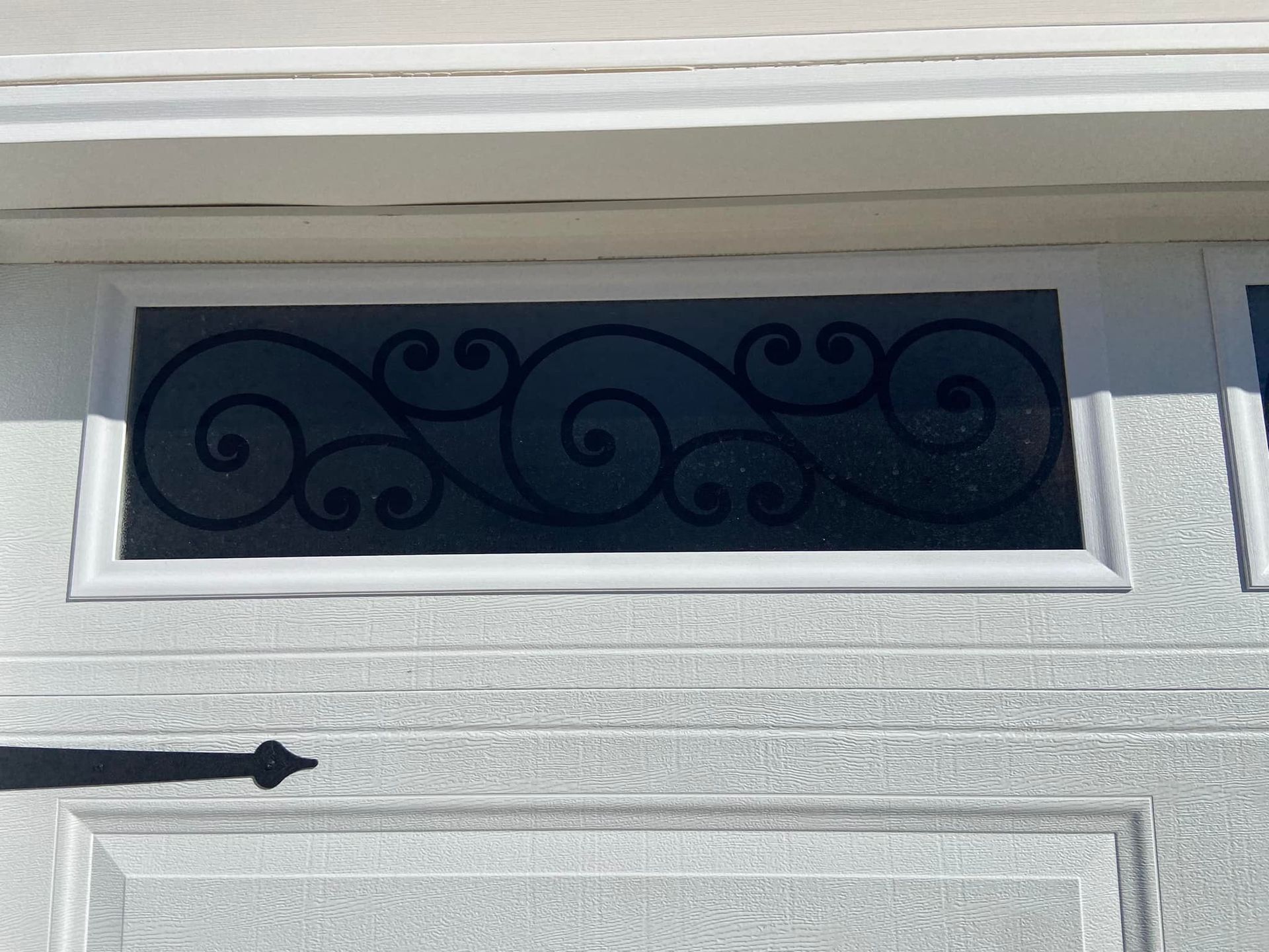 A door with a wrought iron design on it
