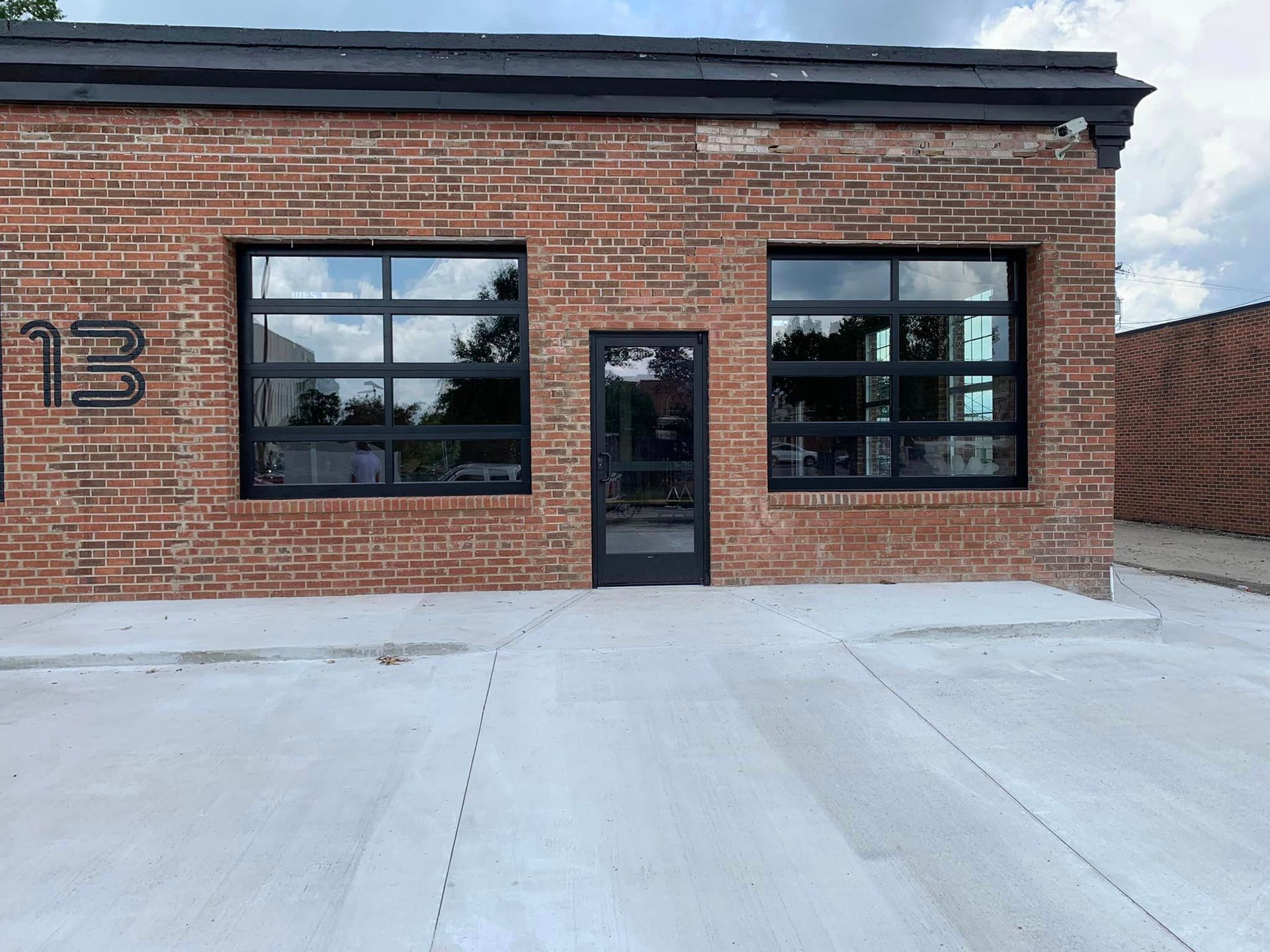 A brick building with the number 13 on the side of it