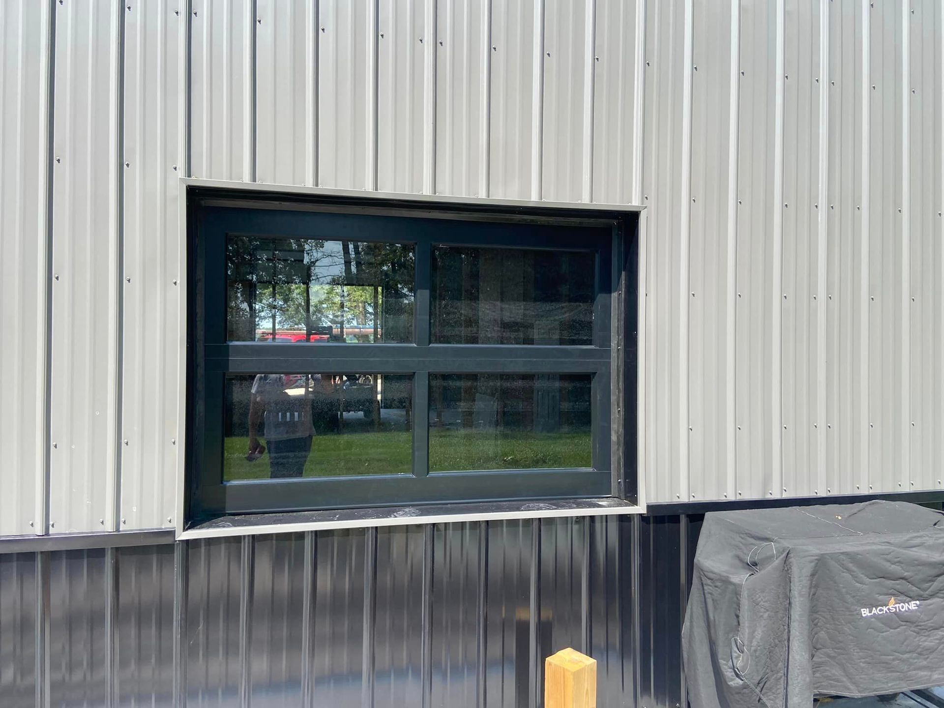 There is a window on the side of a building.