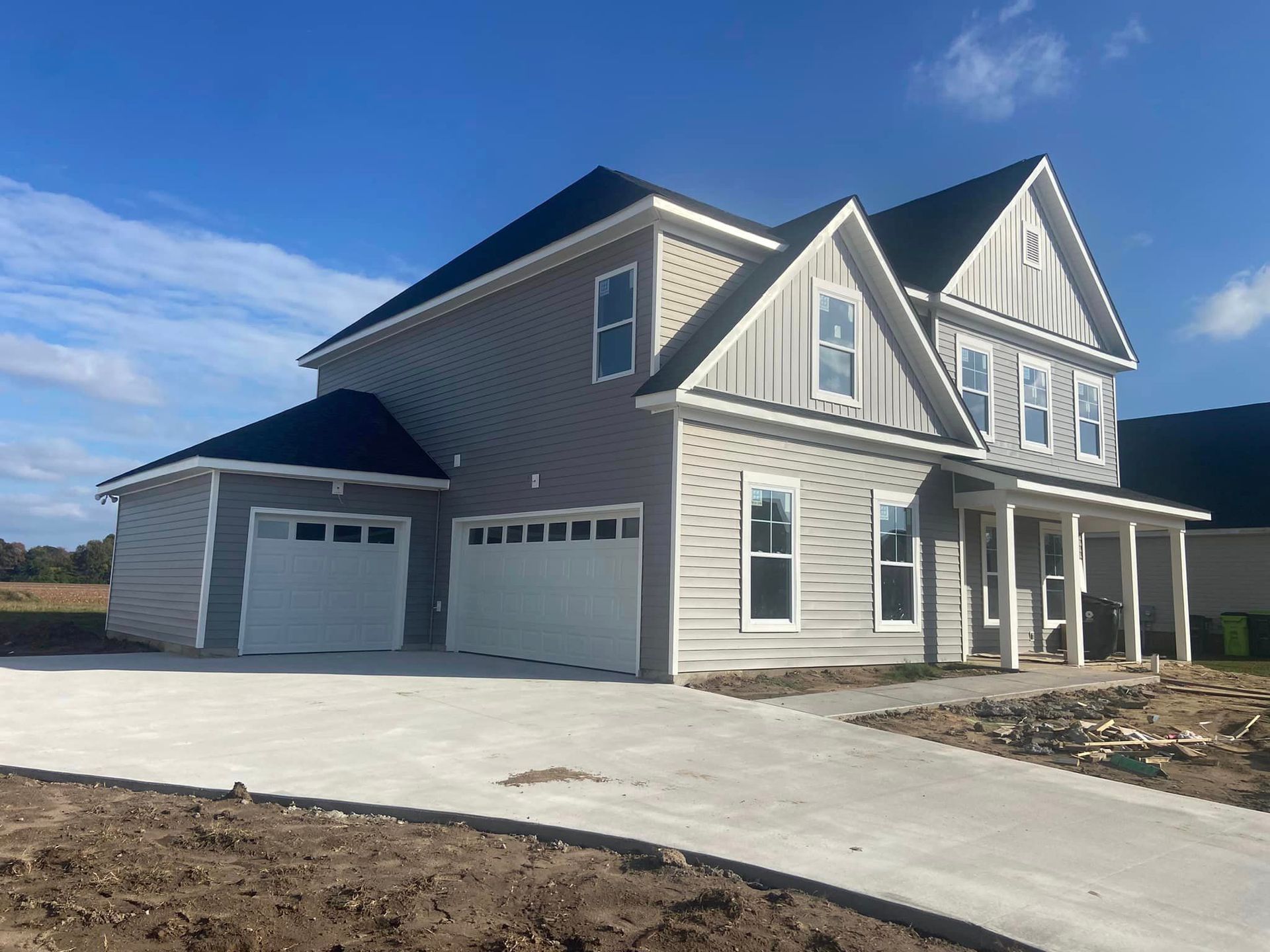 A large house with a lot of windows and a garage