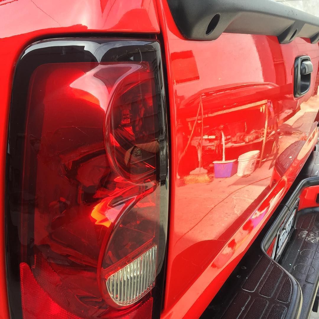 A close up of a red truck 's tail light