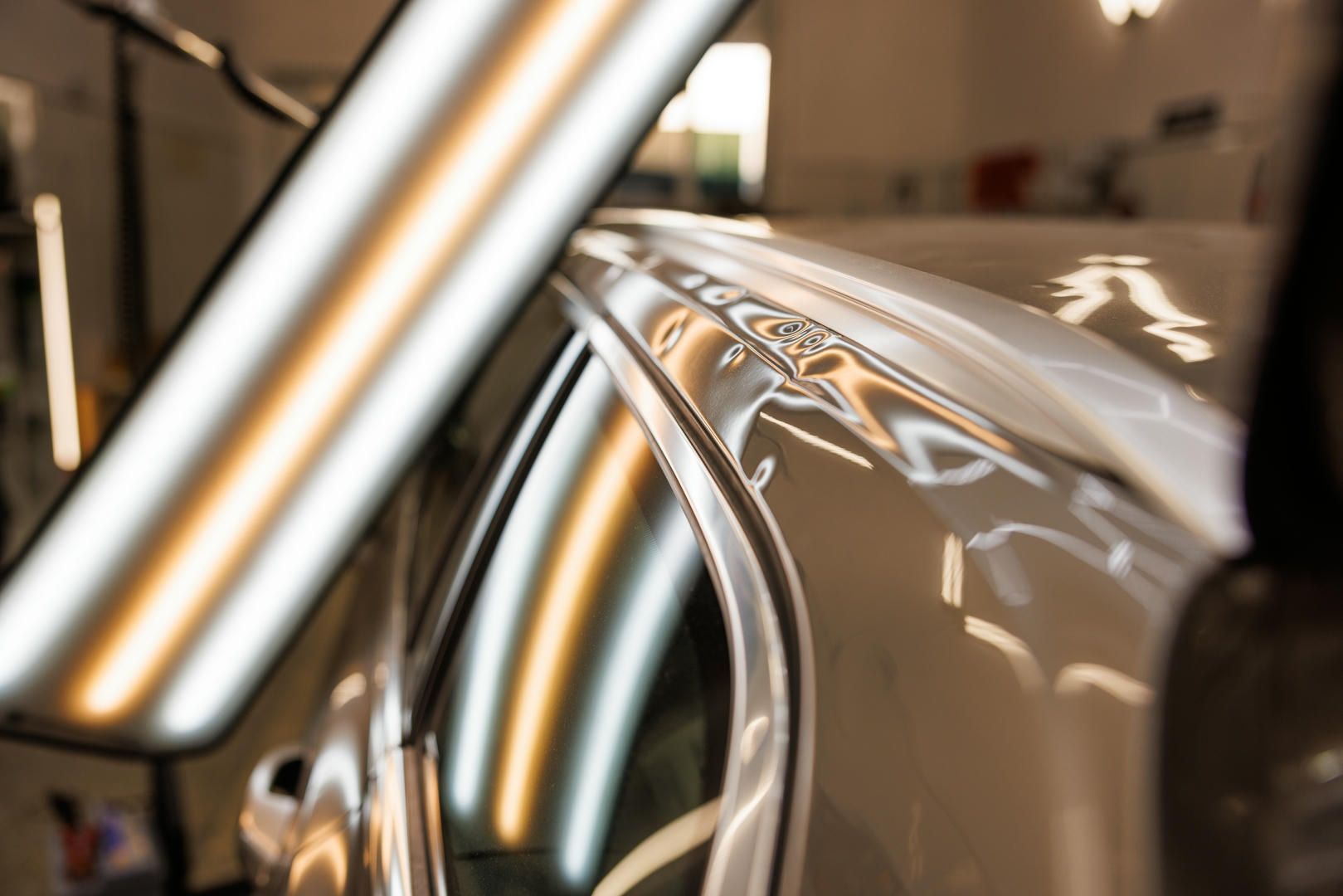 A close up of a car with dents in it