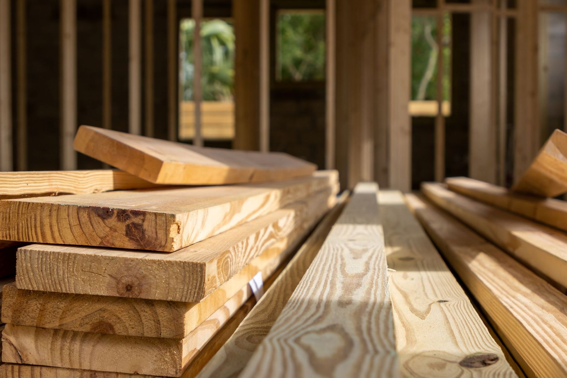 Pile of wooden planks at a building construction site.