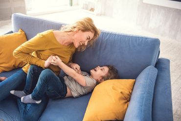 Mom And Son Entertaining In Living Room — Long Beach, CA — Kids Zone Visitation Services