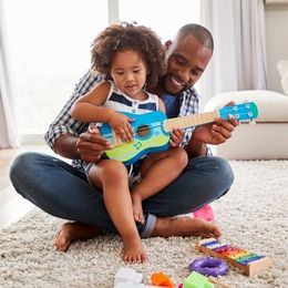 Father And Daughter Playing Guitar — Long Beach, CA — Kids Zone Visitation Services