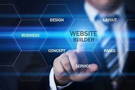 A man in a suit and tie is pointing at a screen that says website builder.